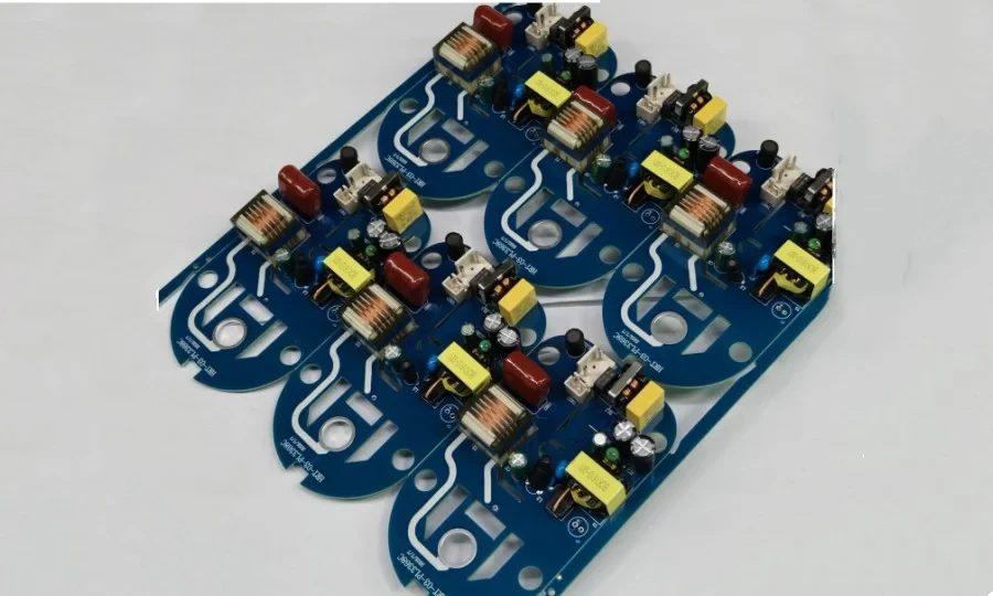 Populated power conversion board with leaded and surface-mount components