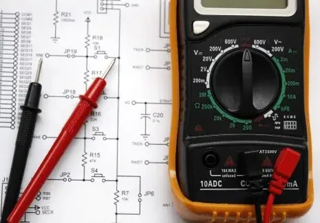 Multimeter alongside a circuit schematic