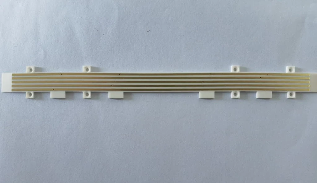 Elongated ceramic circuit with patterned conductor features